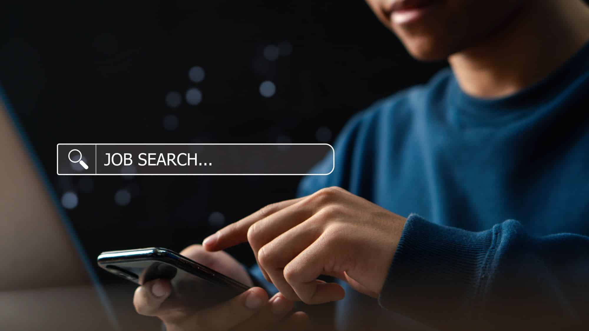 Man searching for job on phone