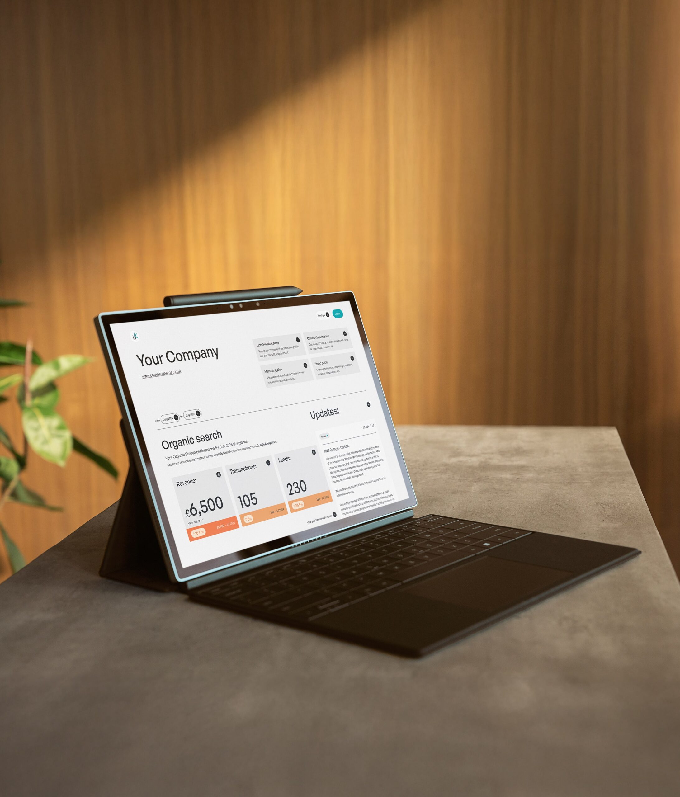 Tablet laptop sitting on counter with example of the Bamboo Nine client hub interface on the screen